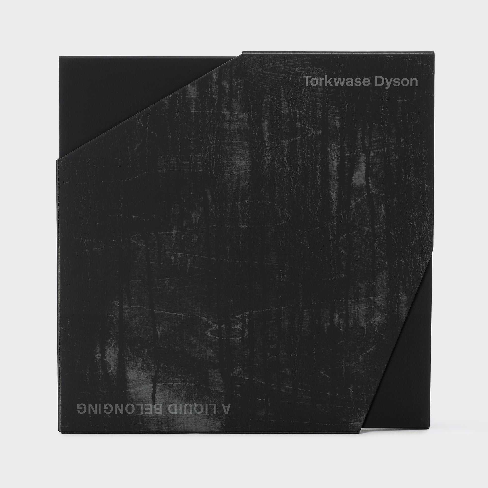 Torkwase Dyson A Liquid Belonging. The black book is inside of a black slipcase that looks weathered.
