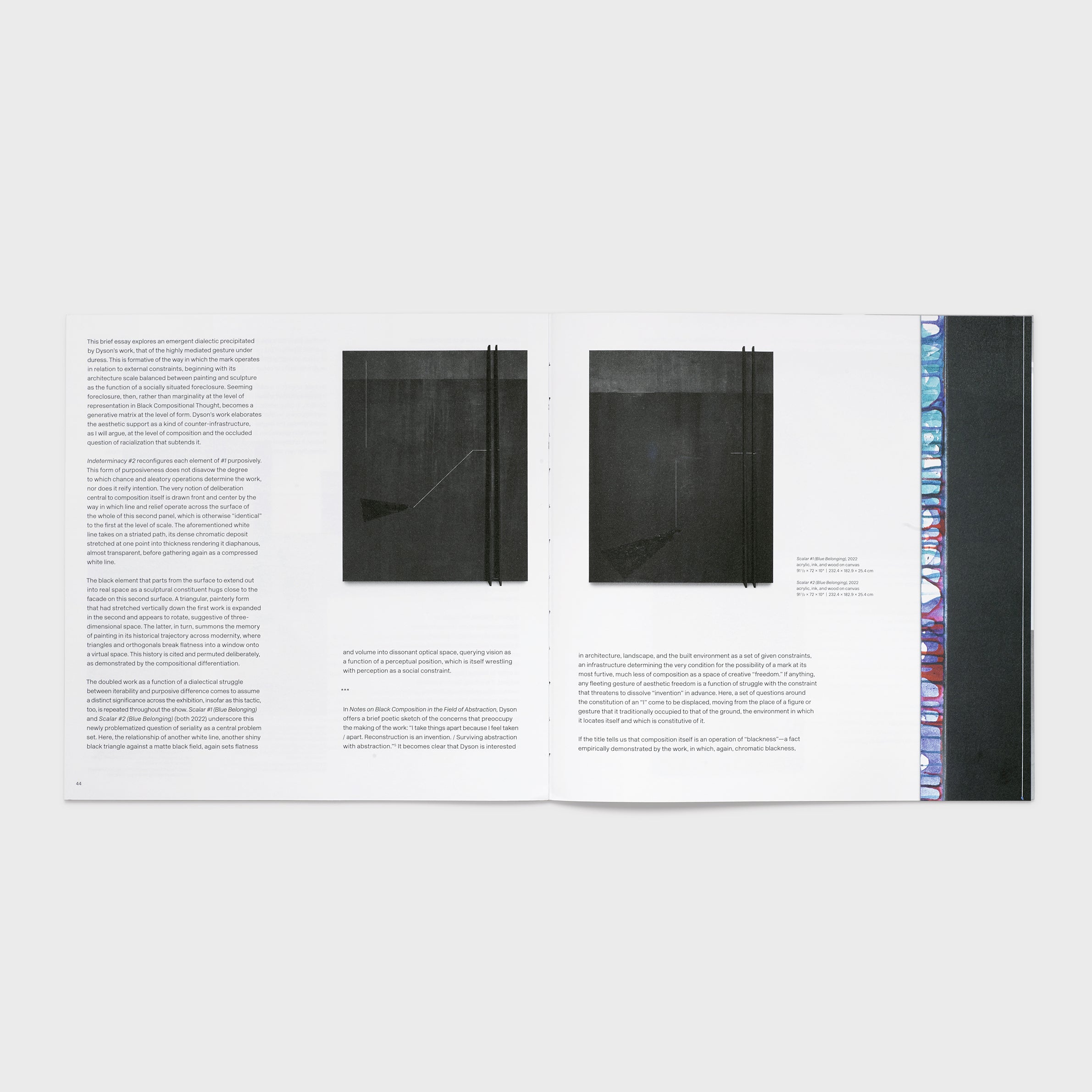 The book is open to two pages. There are two photos of black Dyson works and an essay is across both pages. The background is white and the text is black.