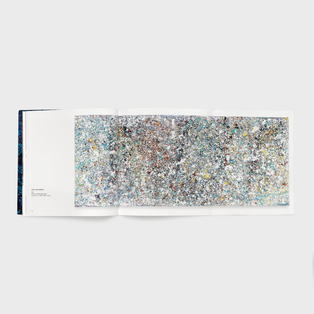 The book is open to two pages with a foldout opened on the right page. An image of one Gilliam work spans all three pages.