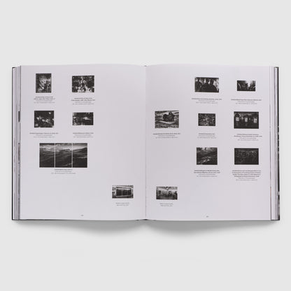 The book is open to two pages. There are 14 images of Robert Longo&