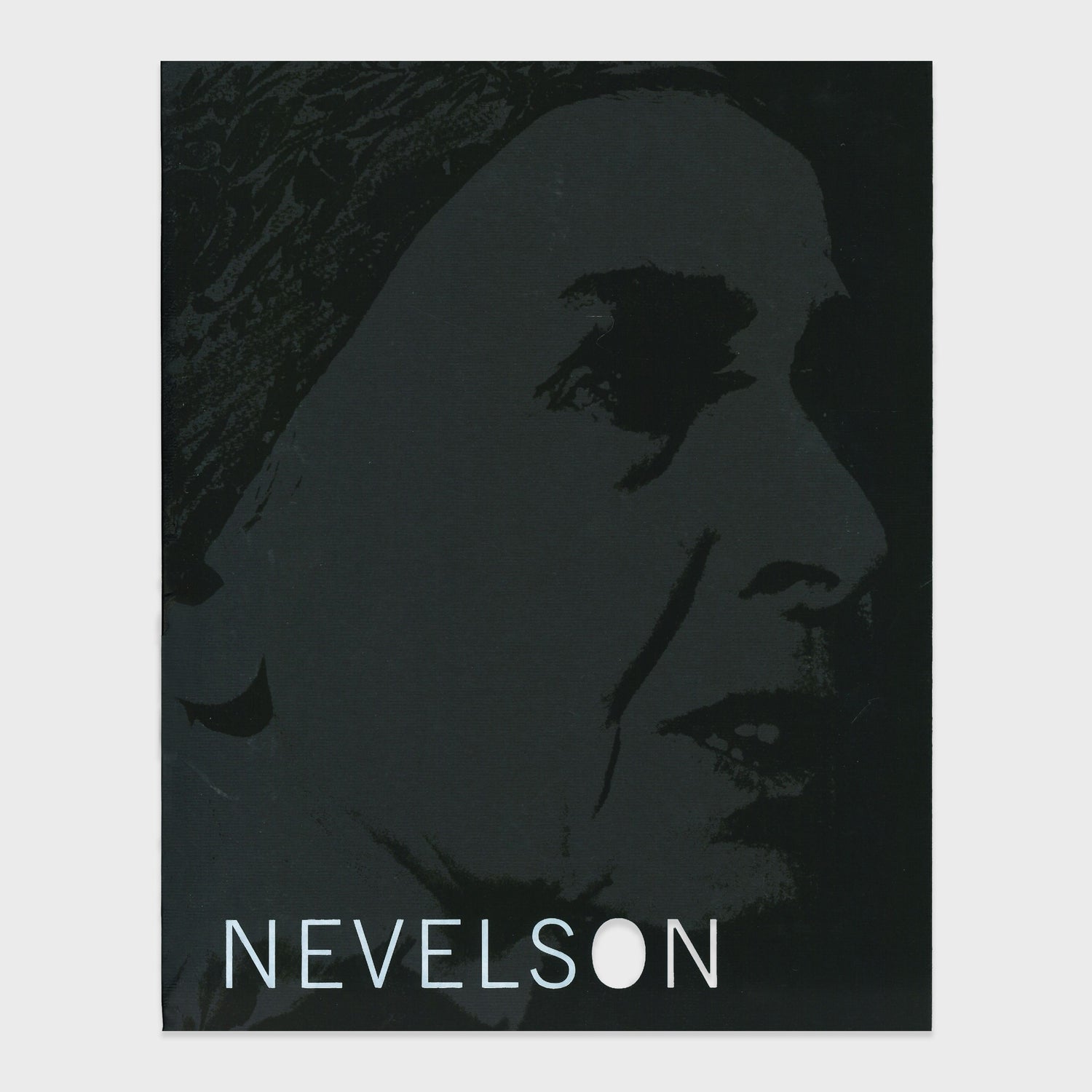 The background of the book cover is black with a portrait of Louise Nevelson printed on it. The title reads &quot;Nevelson&quot; in white text.