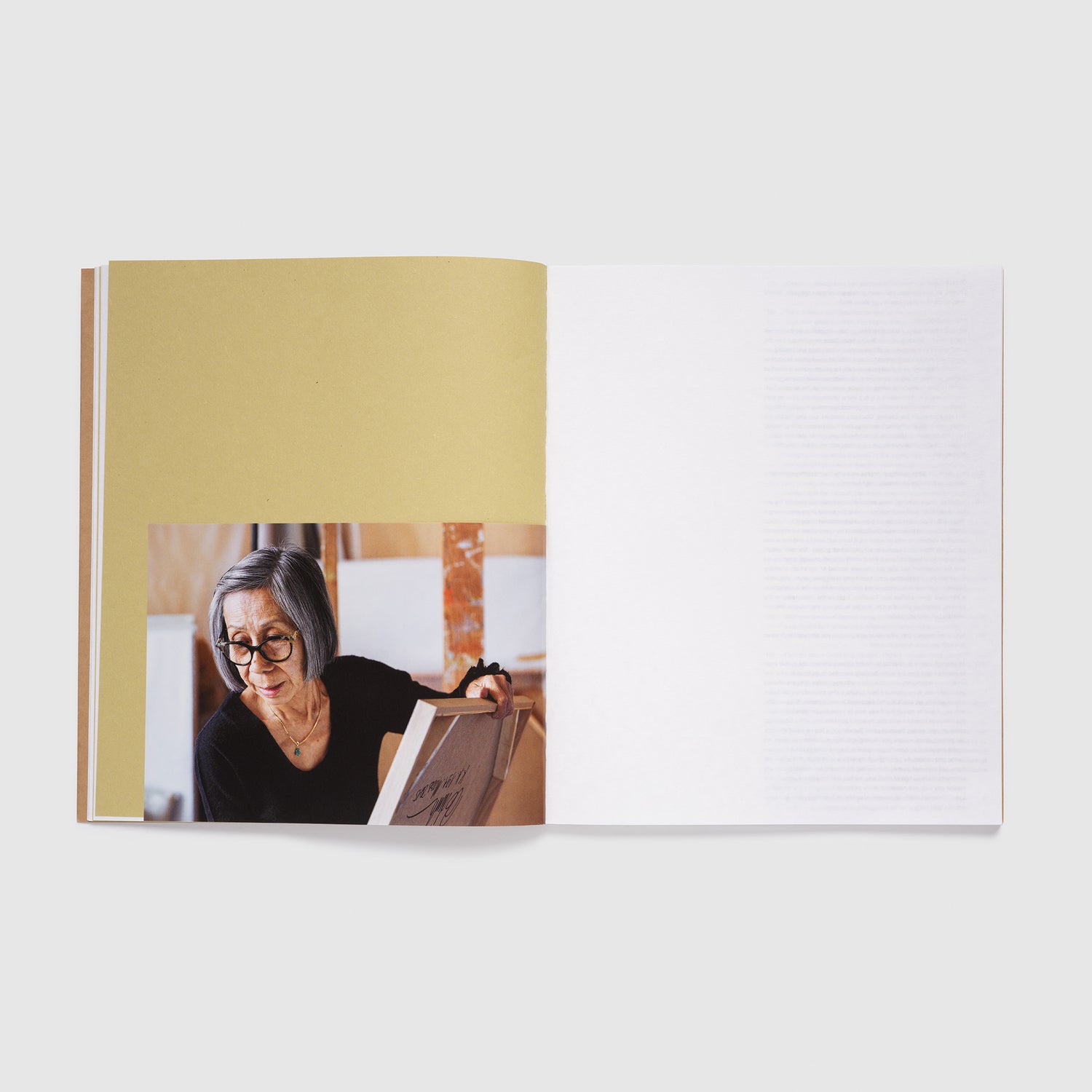 The book is open to two pages. The left page has a portrait of Huong Dodinh and the right page is blank.