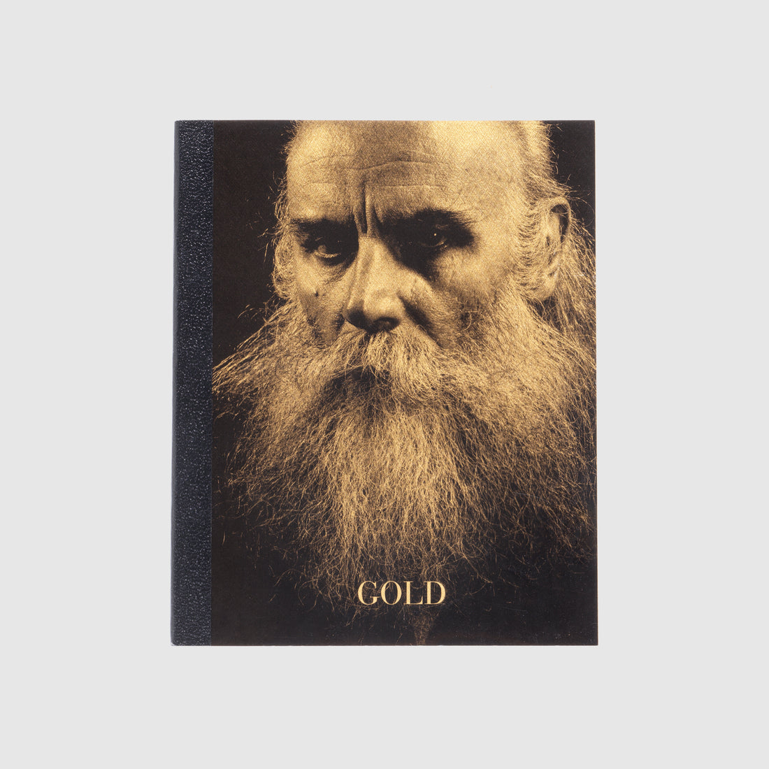 Book cover with a portrait of a bearded man and the word &
