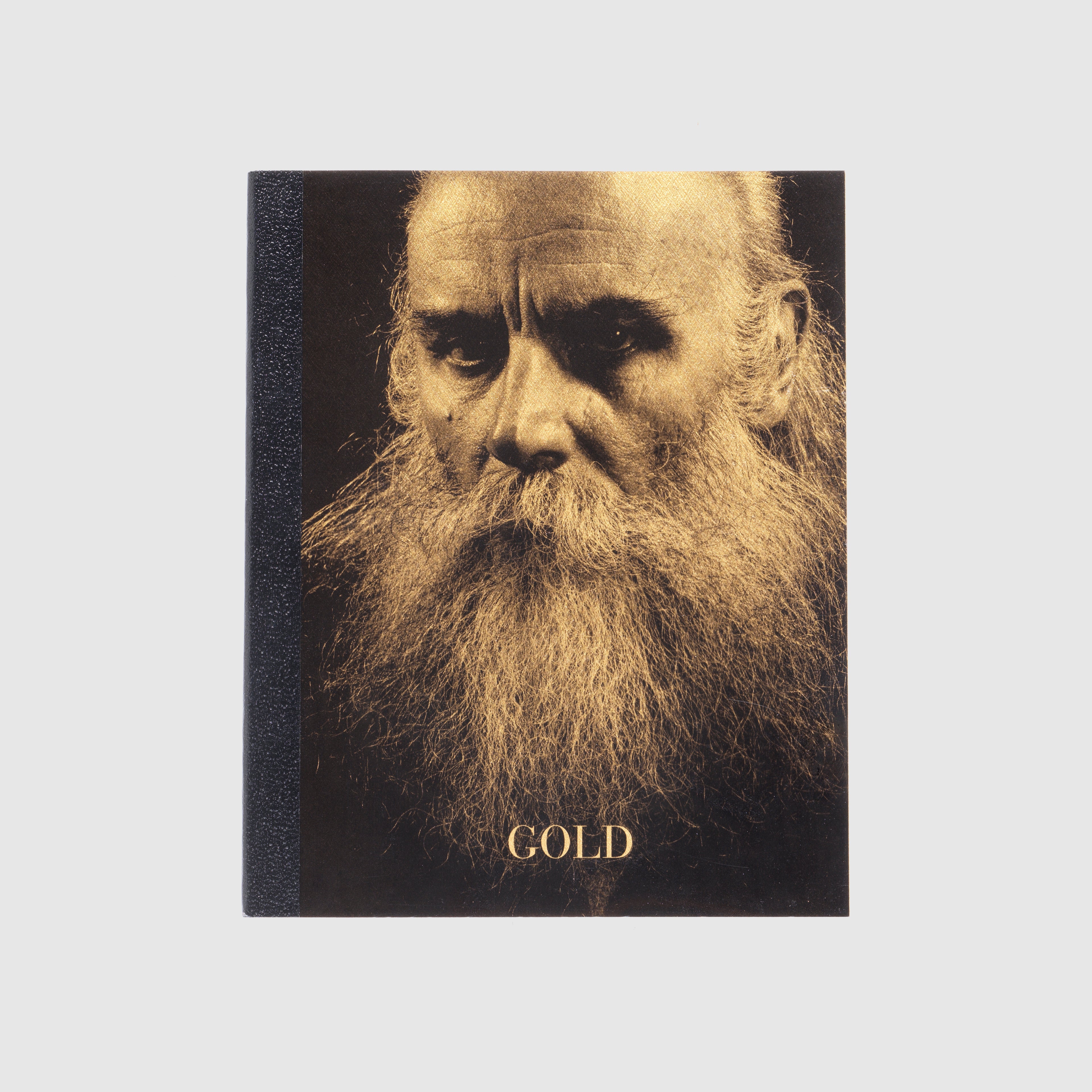 Book cover with a portrait of a bearded man and the word &
