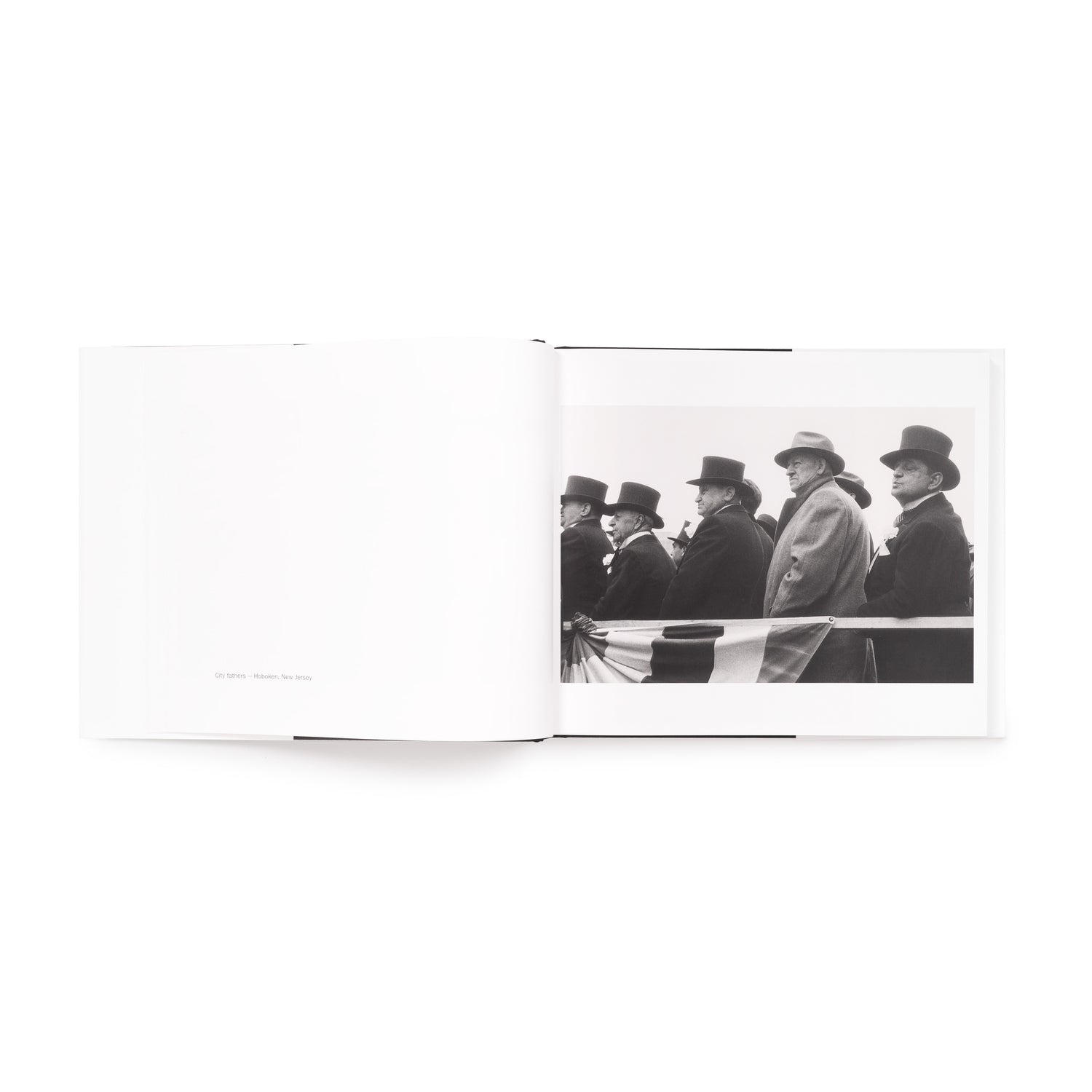 The book is open to two pages. There is a black and white photo by Robert Frank on the right page and information on the photo on the left page.