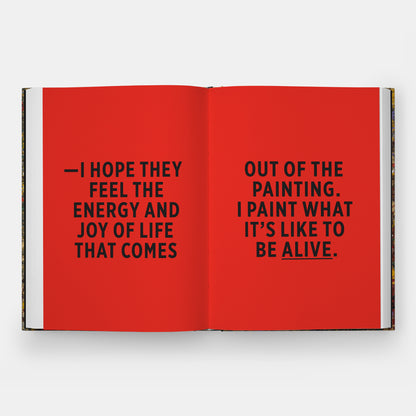 The book is open to two pages. The pages are bright red and printed with bold black letters.