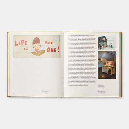 The book is open to two pages. The left page has an image of the artists work and the right page has an essay with photographs of the artists studio.